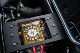 a close up of the top of an electric compressor for an air conditioning sytem in a classic Porsche car