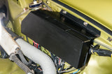 A fuse panel for a Porsche 911 with the cover in place