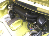 A Porsche 911 air conditioning electric upgraded blower unit in a green car