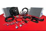 Automotive parts including fans, wiring, and metal components on a red surface.