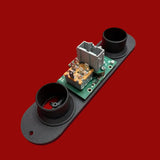 Electronic sensor module on a red background