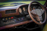 911 SC dashboard and interior in brown showing electric HVAC controls with digital slide controller