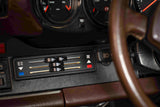911 SC dashboard and interior in brown showing electric HVAC controls with digital slide controller