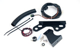 The disassembled components of a washer bottle relocation package for a Porsche 911 sports car