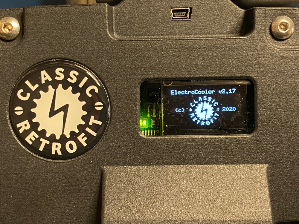 a close up of a digital screen on a smart electric air conditioning compressor showing home screen